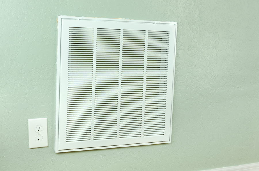 Home air conditioner and heating air filter intake vent on wall that leads to the handler. Air Handler Maintenance.