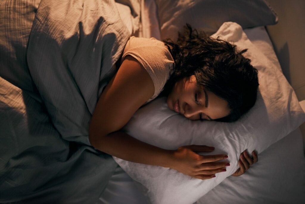 Blog Title: Your HVAC System Can Enhance Sleep Photo: Woman sleeping